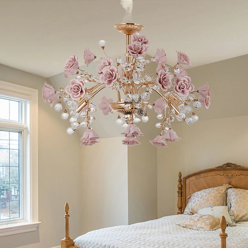 Rose Crystal LED Chandelier with delicate pink flowers and crystals, adding charm and warmth to a classic bedroom setting.