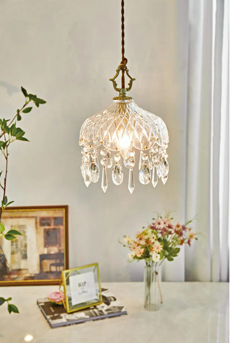 French Vintage Crystal Chandelier - Copper Hanging Lamp illuminating a cozy room with floral decor and framed art.