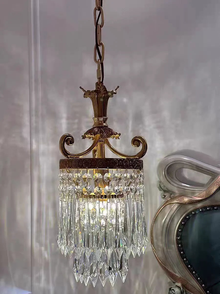 Illuminated retro French chandelier with cascading crystals, creating a luxurious lighting effect in classic interiors.