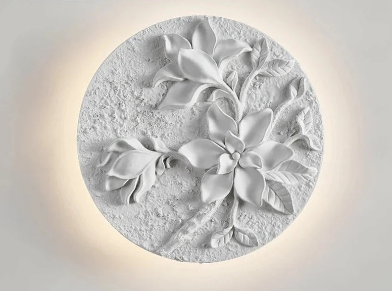 Textured floral round sconce with sculpted petals and leaves, perfect for vintage-inspired wall lighting in kitchens or bathrooms.