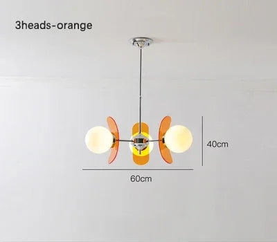 3-head orange Bauhaus retro chandelier with LED globes, 60cm wide, compact and stylish for small dining areas.