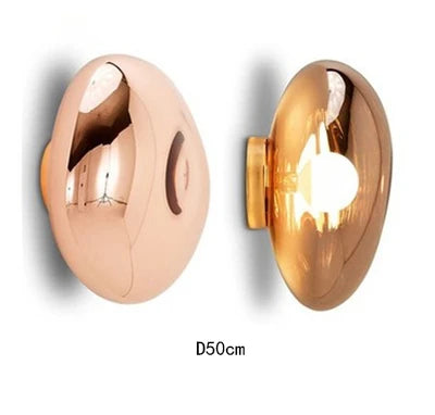 Side view of 50cm copper and gold lava wall lamps showing reflective finish and LED light source.