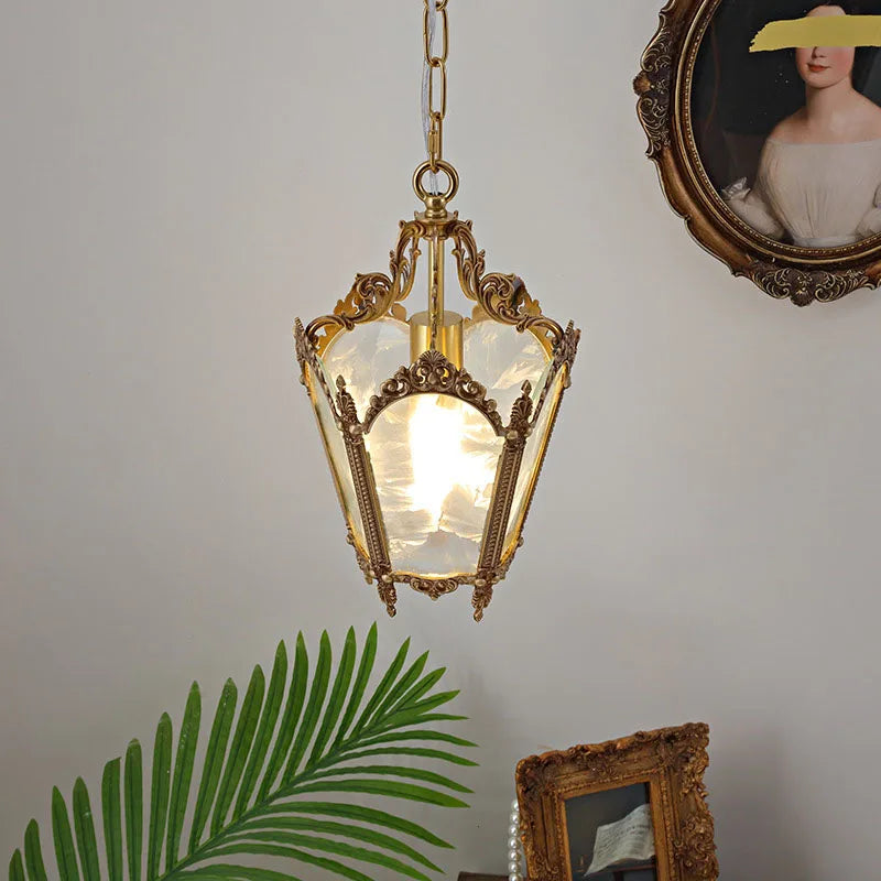 French retro glass chandelier in copper finish hanging in a vintage-style room. Compact and energy-efficient for home lighting décor.