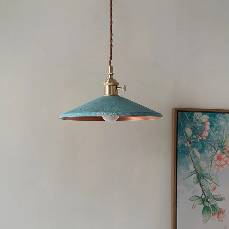 Vintage Metal Lamp in teal with brass fixture, perfect for stylish home interiors or cozy coffee shop lighting.
