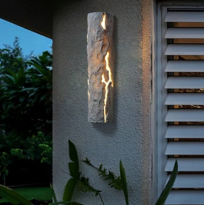 LED Resin Wall Lamp in white stone finish, mounted on patio wall, IP65 waterproof for stylish and durable outdoor lighting.