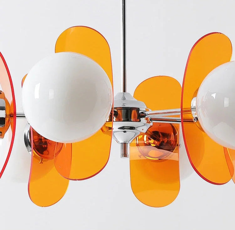 Close-up of orange acrylic panels and LED globe bulbs on Bauhaus retro chandelier, showcasing modern ceiling light design.