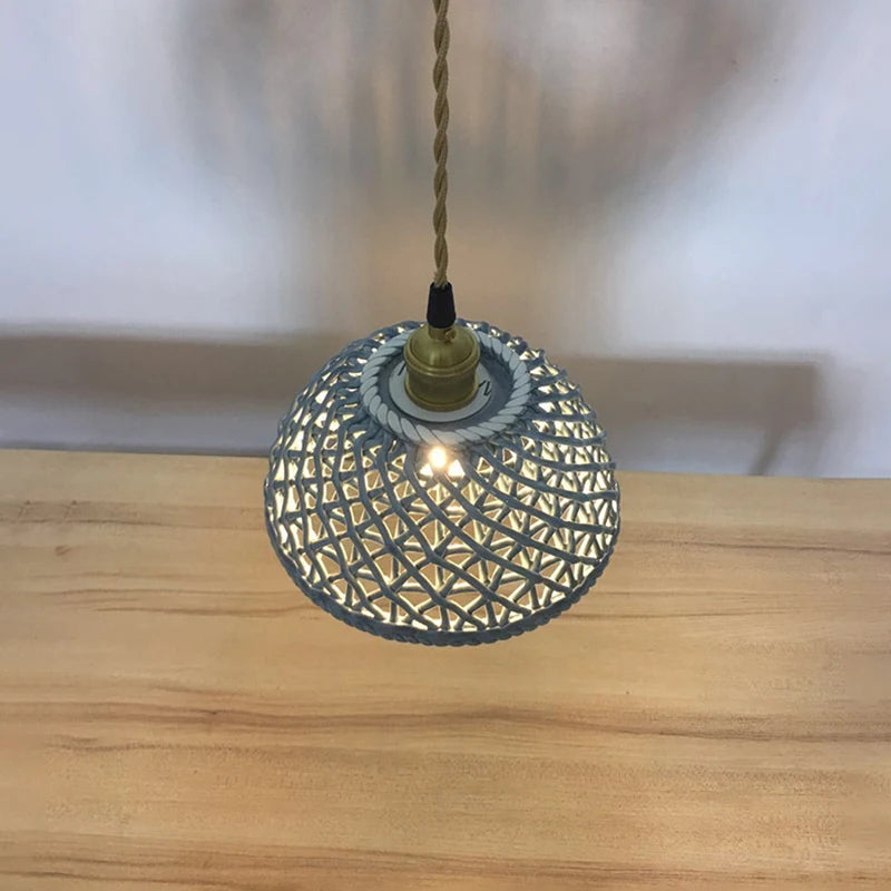 Top view of blue LUXELY ceramic Japanese pendant light above wooden table, blending traditional design with modern lighting.