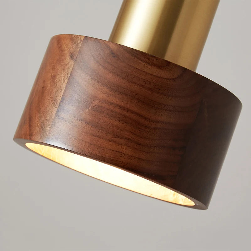 Close-up of LUXELY walnut wood pendant lamp showing rich wood grain and brass accent, perfect for vintage or retro decor.