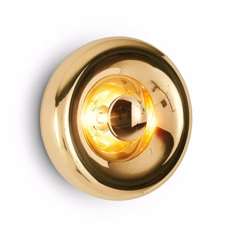 Gold glass round lava wall lamp with modern art deco style, ideal for upscale living room or hotel lighting.
