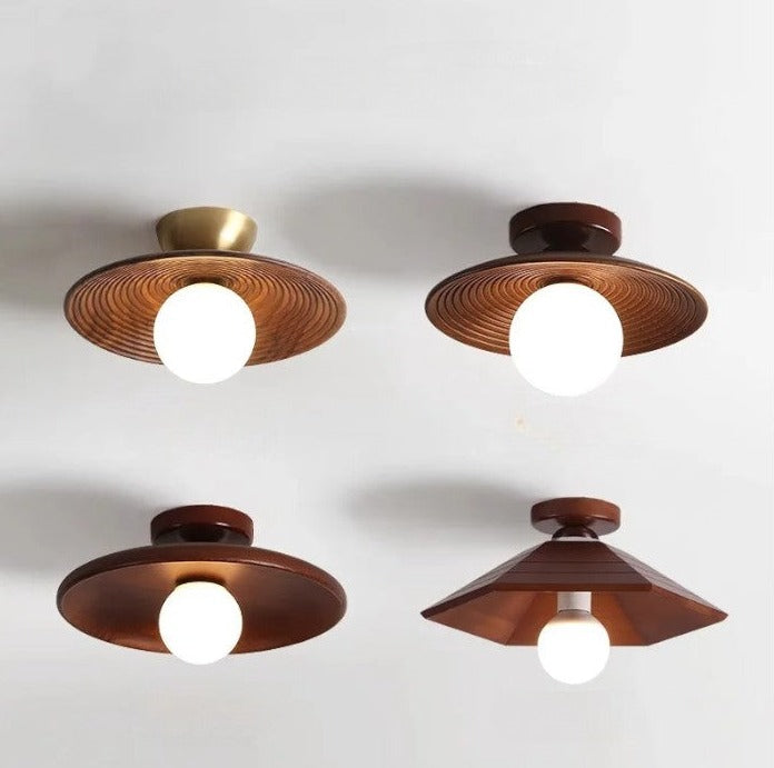 Four variations of LUXELY wood flush mount ceiling lights with brass and walnut finishes, ideal for modern and vintage-themed interiors.