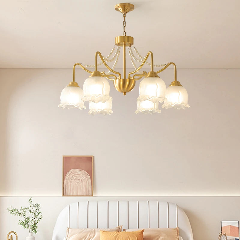 Modern ceiling light with gold copper finish and six frosted glass shades, enhancing bedroom decor with American chandelier design.