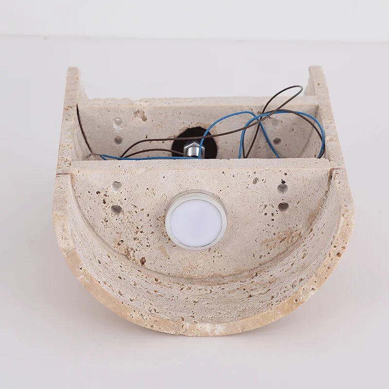 Back view of travertine wall lamp IP65 showing internal wiring and LED socket, designed for waterproof outdoor use.