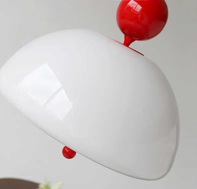 Close-up of glossy white dome with red top on the Medieval Pendant Light, highlighting its vintage design details.