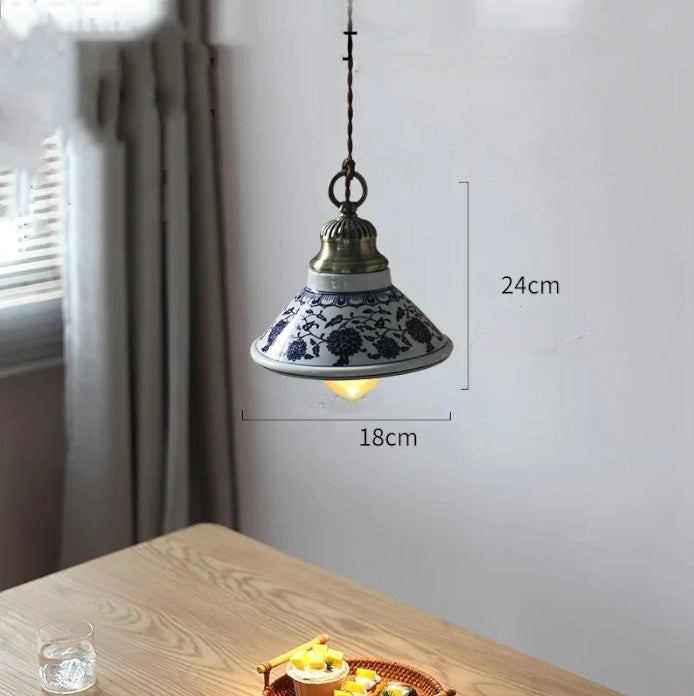 Floral ceramic pendant light with LED bulb, 18cm wide and 24cm tall, ideal for cozy dining or living spaces.
