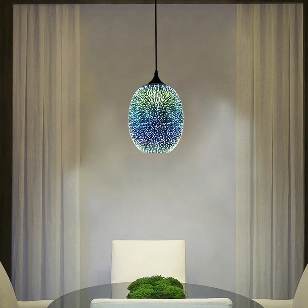 Glass sphere pendant light with modern fireworks 3D effect hanging above a dining table, creating a stylish and ambient atmosphere.