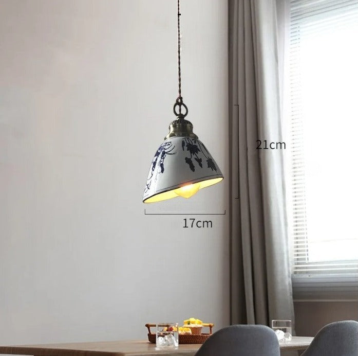 Blue floral ceramic pendant light with LED bulb, 17cm wide and 21cm tall, ideal for dining or kitchen lighting.