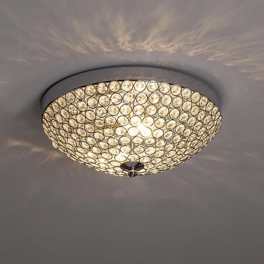 Crystal ceiling light - luxury LED modern chandelier with silver finish, mounted on ceiling casting elegant light patterns.