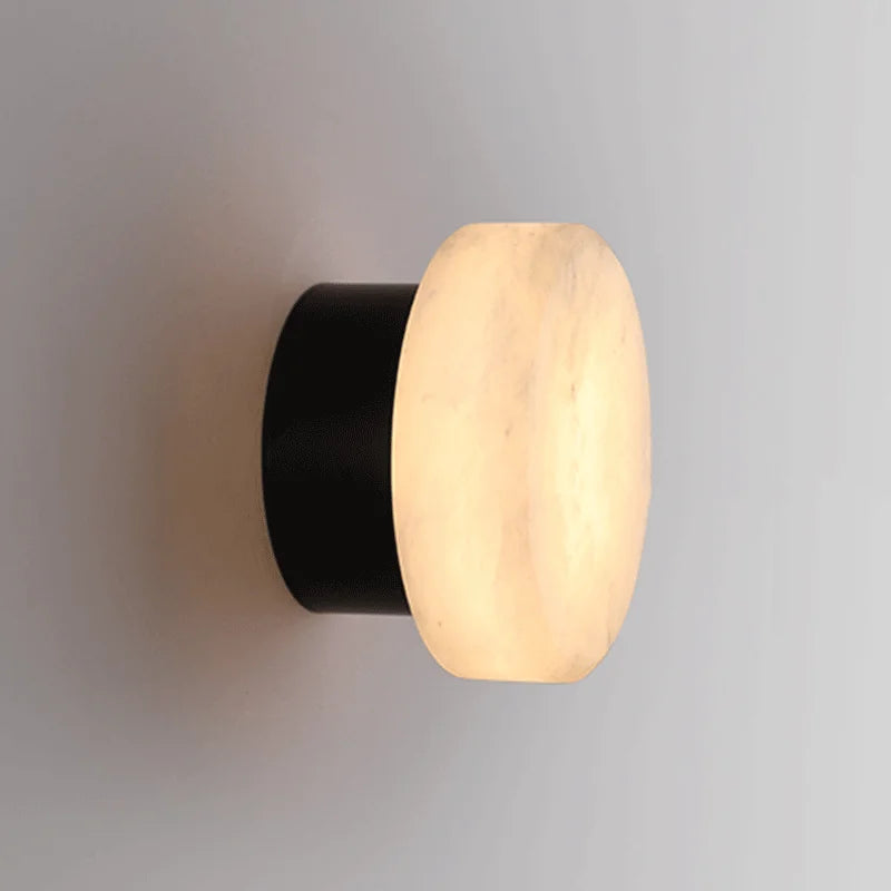 Side angle of Modern LED Marble Wall Lamp with black base and glowing marble shade, perfect for corridor or hallway use.