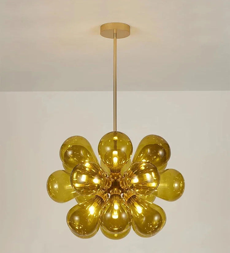 Amber bubble glass chandelier with black lampbody, a Scandinavian pendant light ideal for warm, modern interiors.