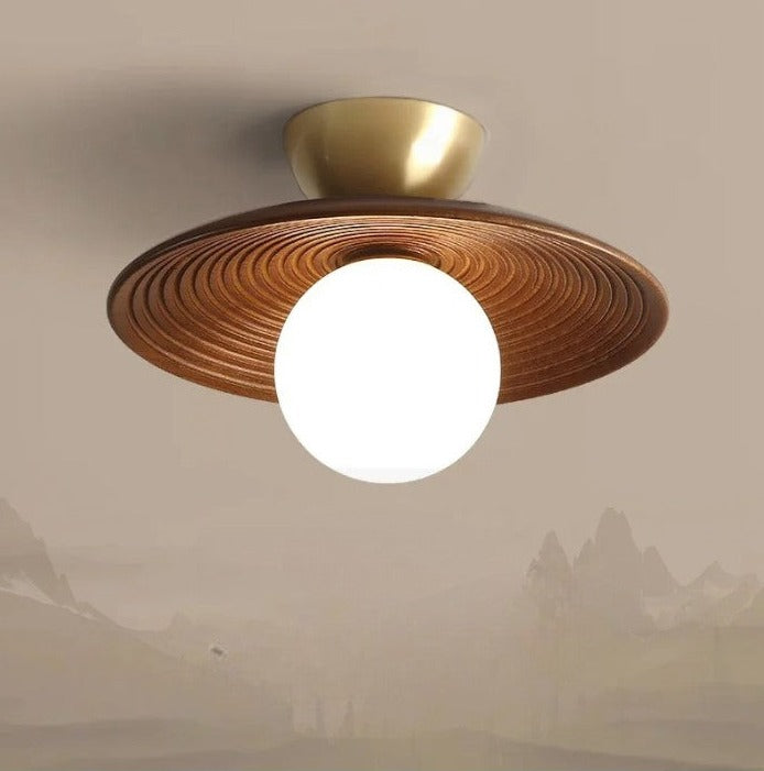 LUXELY modern wabi-sabi walnut wood and brass ceiling light installed in a minimalist room, blending natural tones with soft ambient lighting.