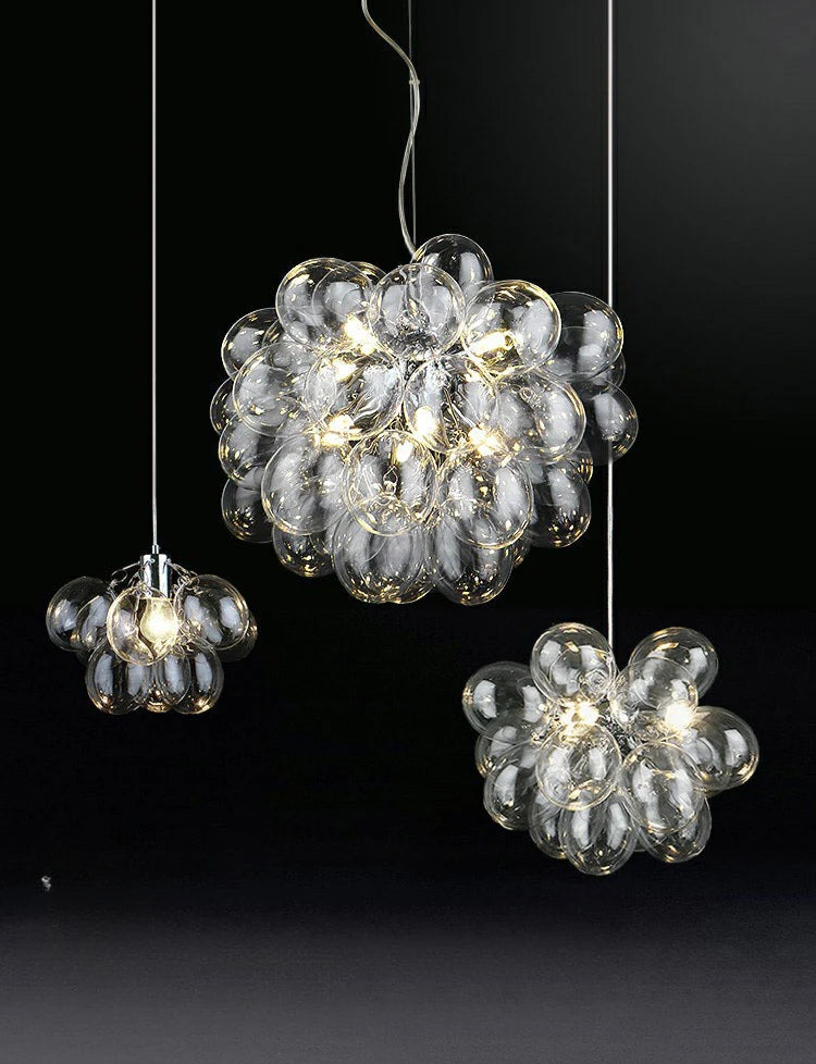Modern grape glass chandelier trio in clear glass finish, featuring LED lights for elegant and sustainable home lighting.