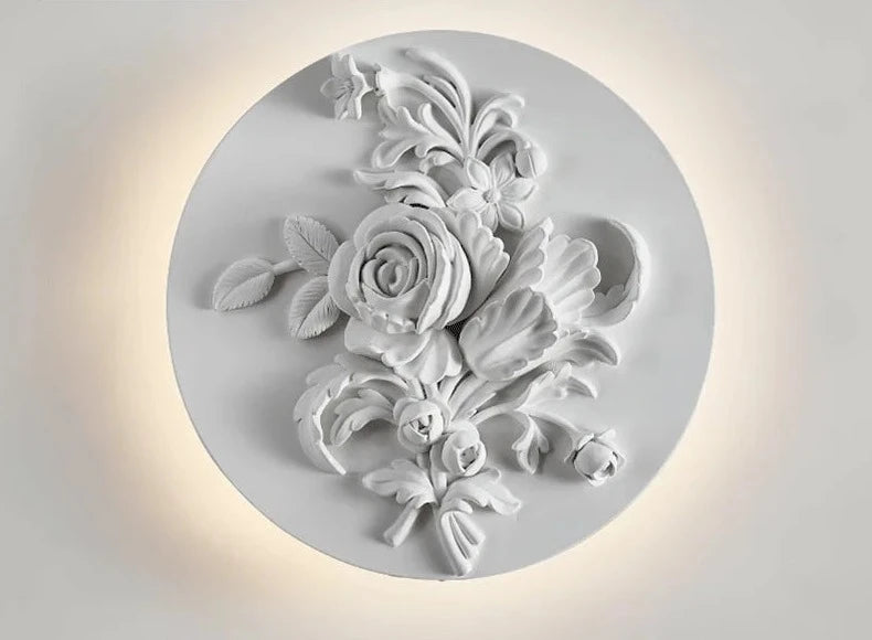 French vintage sconce with sculpted roses and foliage, round LED wall light for elegant home or restaurant interiors.