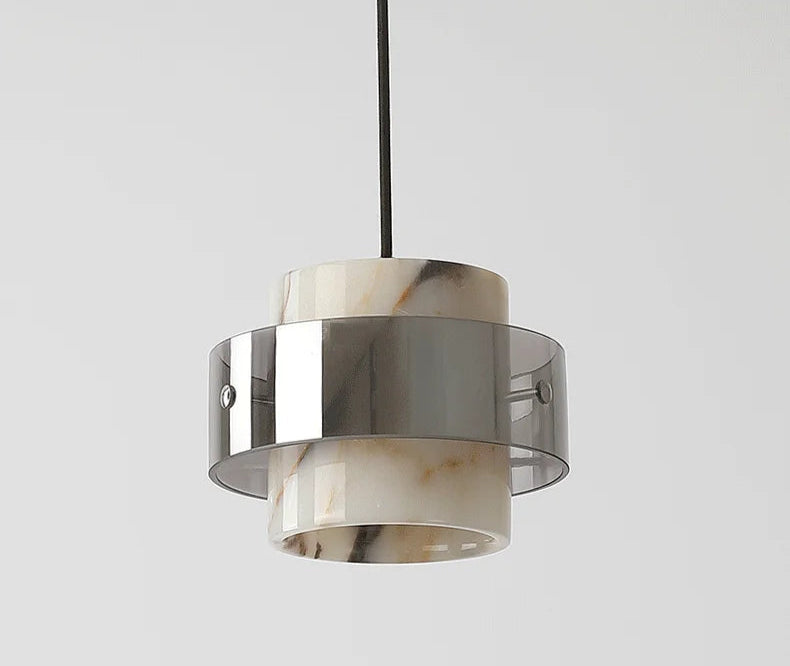 Comparison of the Stone Drop Pendant - LED Marble Light turned off and on, showing its ambient lighting effect for home decor.