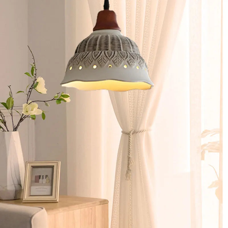 Nordic Ceramic Chandelier - LED Pendant Light Vintage illuminating a softly lit living room with white curtains and floral decor.
