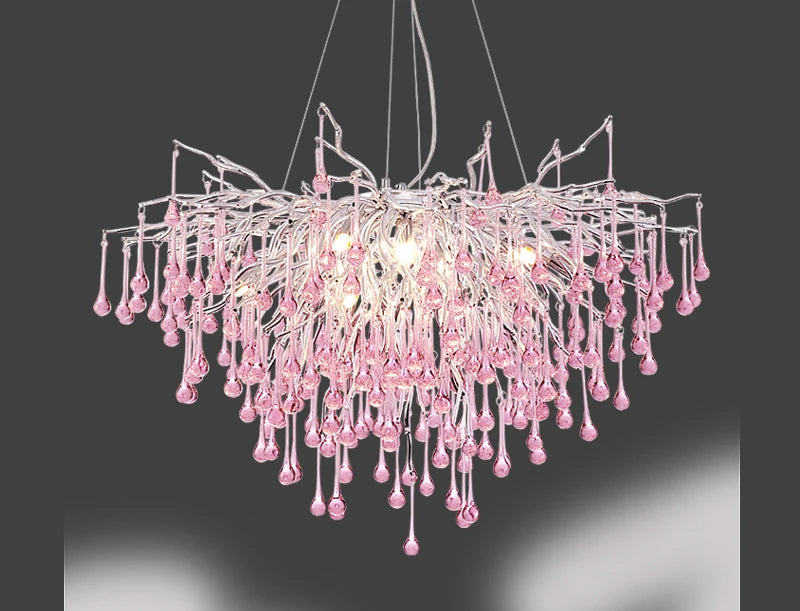 Pink crystal chandelier with LED bulbs on a dark background. Highlighting modern design and crystal clarity.