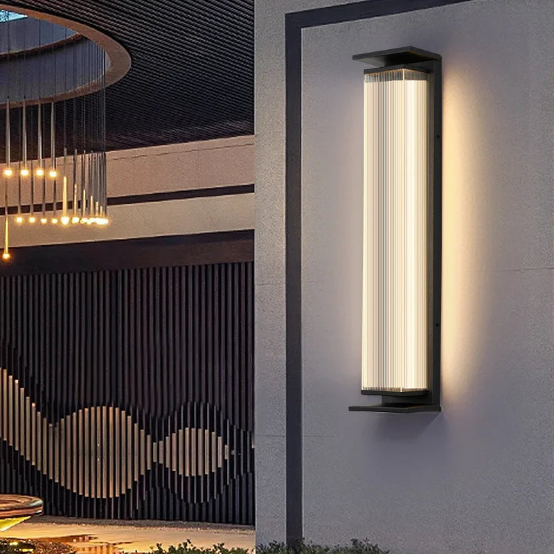 Contemporary stainless steel outdoor wall light enhancing a stylish patio with warm, waterproof illumination.