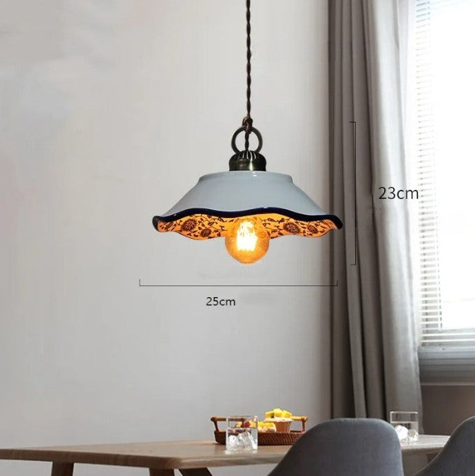 Scalloped ceramic pendant light with orange interior, 25cm wide and 23cm tall, ideal for vintage kitchen lighting.