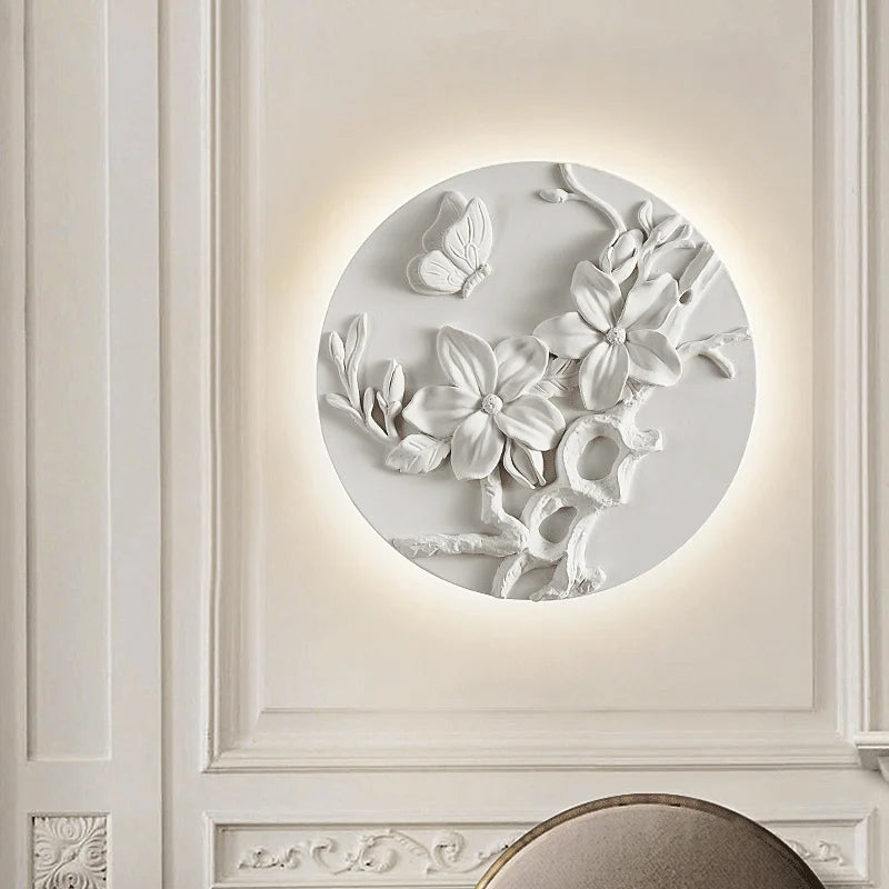 French vintage wall sconce with butterfly and magnolia flower relief, offering soft LED backlighting for classic bedroom or hallway decor.
