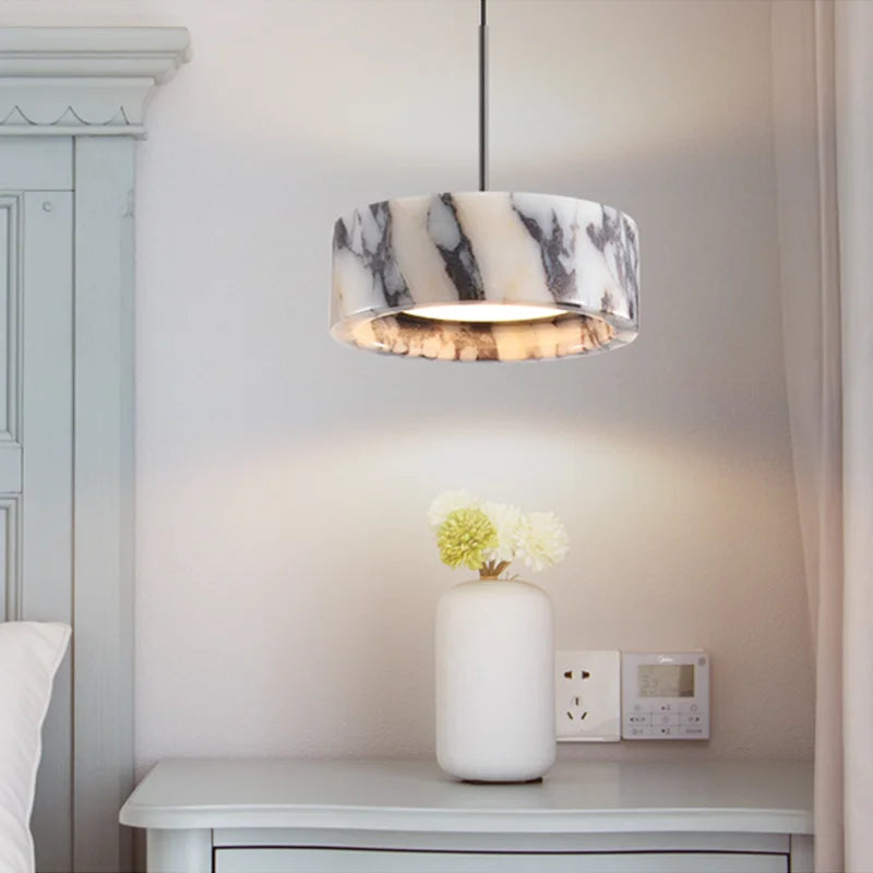Black Marble Dome Pendant - LED Lamp mounted beside a bed, providing soft lighting and a luxurious marble accent to the bedroom decor.