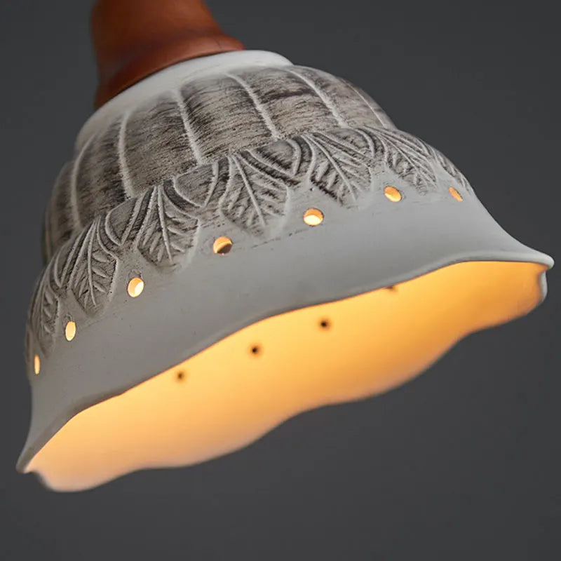 Close-up of Nordic Ceramic Chandelier - LED Pendant Light Vintage showing intricate ceramic leaf patterns and soft LED glow.