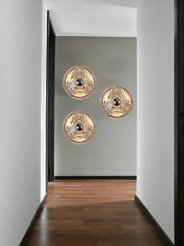 Modern hallway featuring three designer glass wall lamps with LED lights, perfect for stylish home or shop decor.