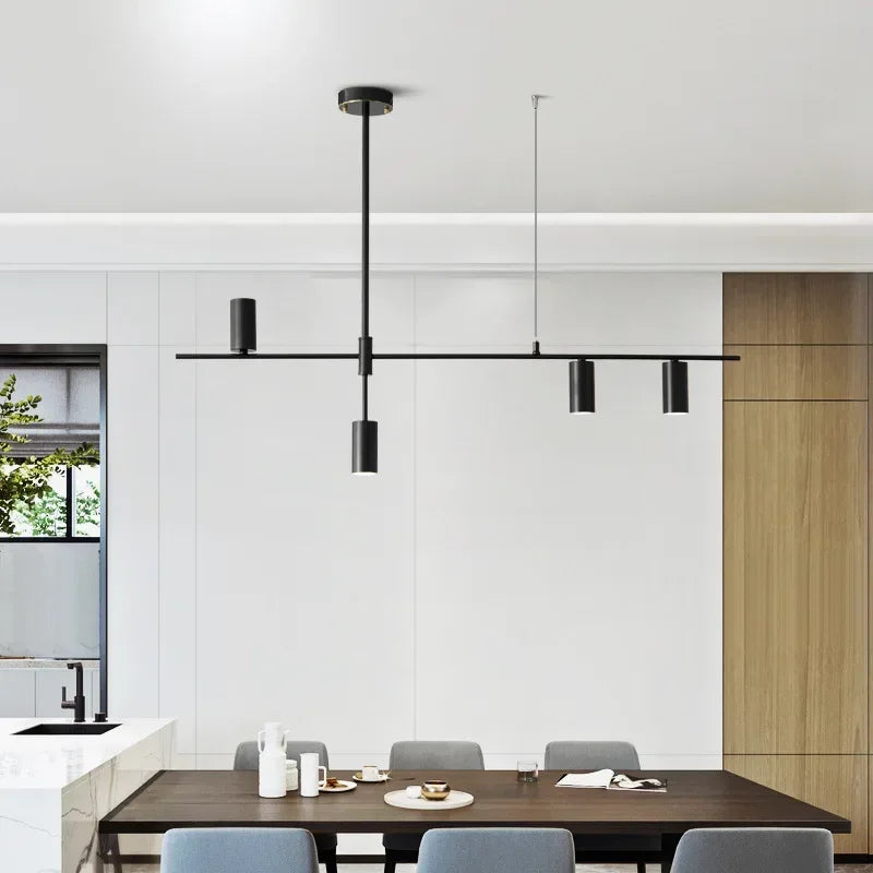 Dining room setup with modern minimalist spotlight bar ceiling light in black, enhancing contemporary interior design aesthetics.