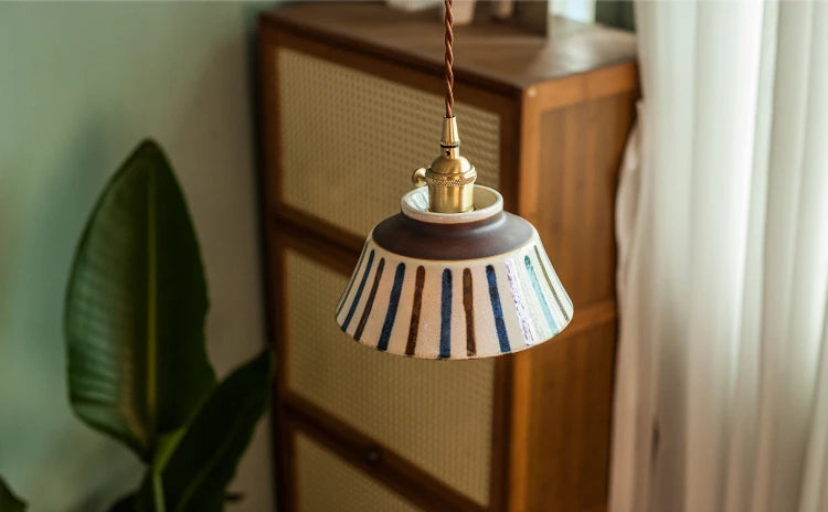 Overhead view of striped Porcelain Pendant Light in retro Chinese style. Elegant lighting for vintage-themed rooms.