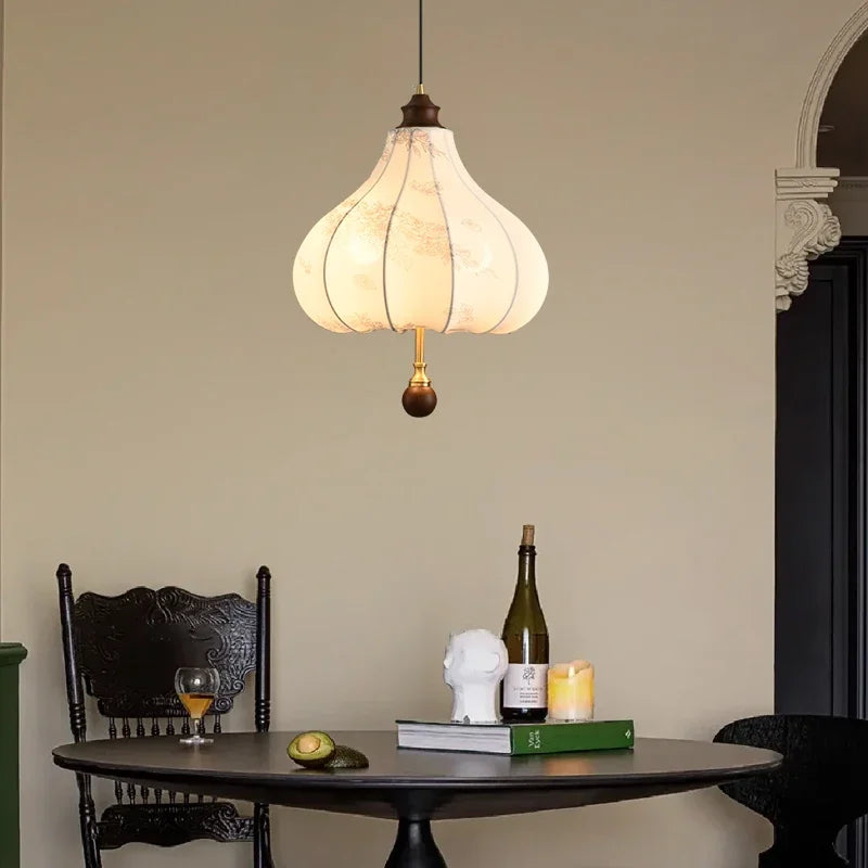 Modern Art Hanging Lamp with tulip-shaped cloth shade and wood detailing, a Nordic pendant light for cozy dining spaces.