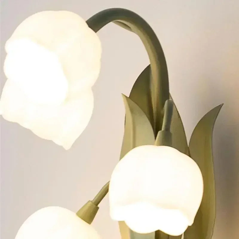 Close-up of tulip-shaped LED bulbs on the Nordic Atmosphere Wall Lamp, showcasing soft lighting and detailed floral design.