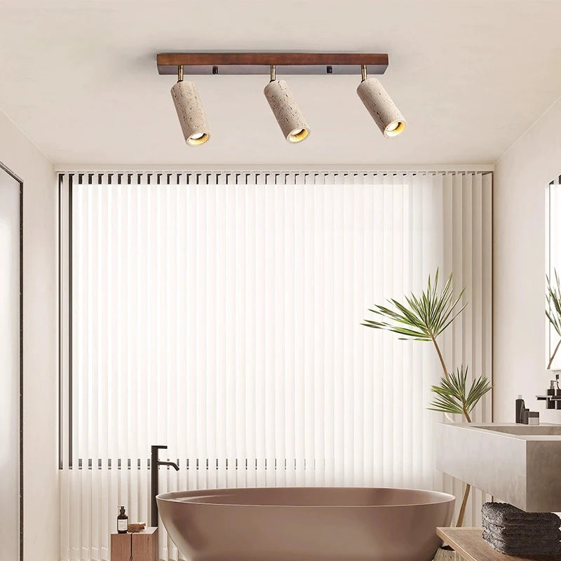 Track spotlight stone ceiling light with wood accent installed in a bathroom, enhancing the space with warm, adjustable lighting.