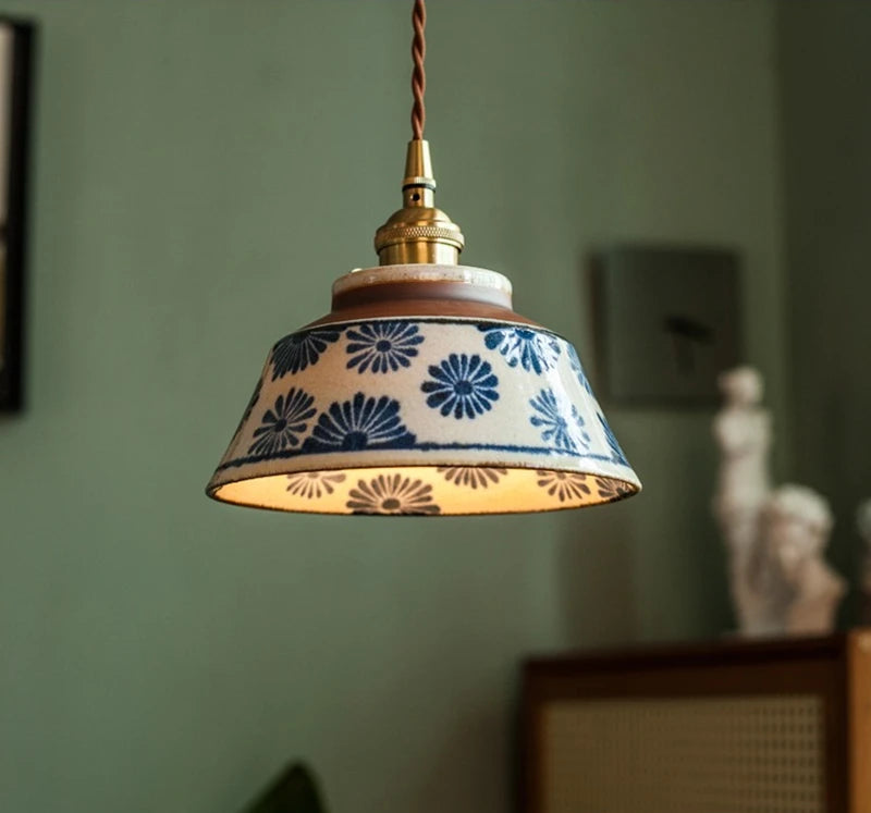 Vintage ceramic pendant lamp with blue floral pattern and LED bulb, perfect for cozy and elegant room lighting.