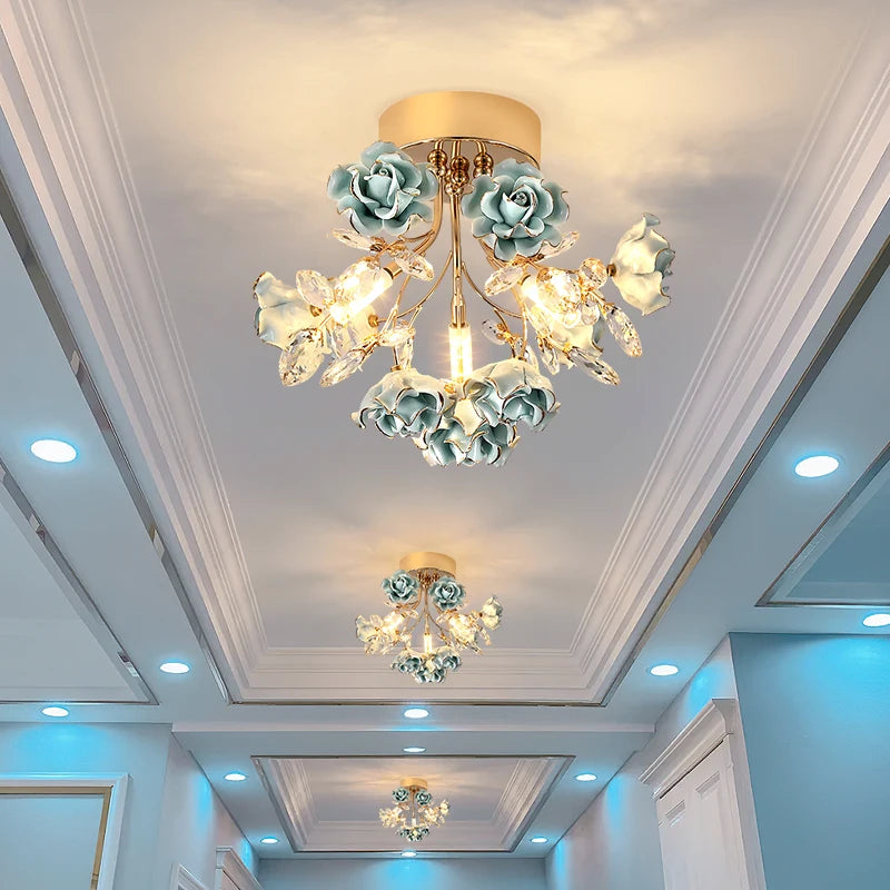 Blue kids rose crystal chandelier lighting up a hallway with elegant floral design and sparkling crystal accents.