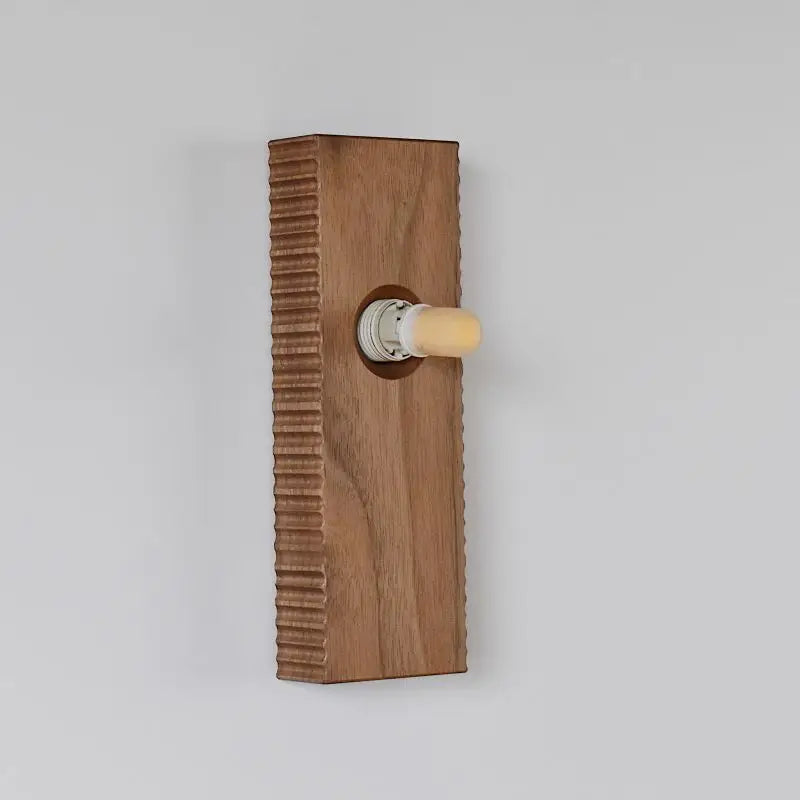 Back view of the LUXELY walnut wood wall lamp showing bulb socket and ribbed wood texture for modern interiors.