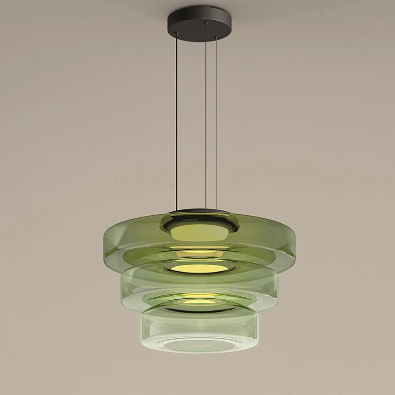 Three-tier green glass pendant light with LED, ideal for luxury kitchen or dining room decor. Features layered circular design.