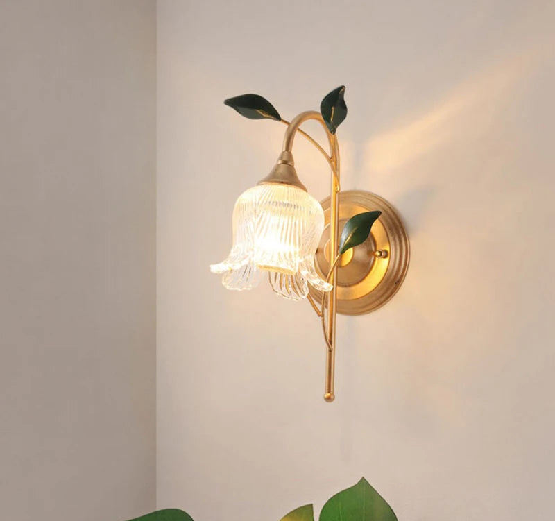 Vintage-style French Wall Sconce Light with LED flower-shaped glass shade and golden stem, ideal for elegant living room wall decor.