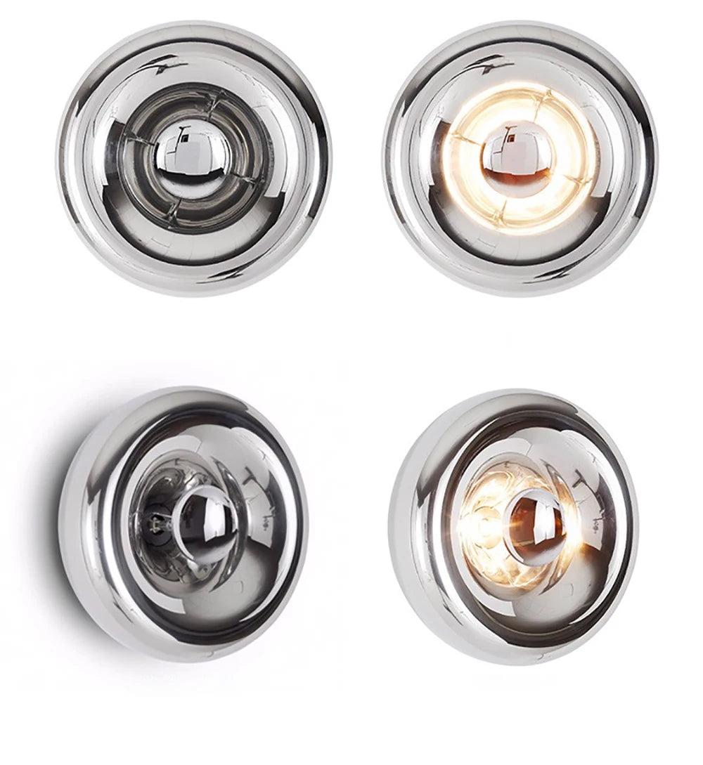 Set of four silver round lava wall lamps with reflective finish and LED glow, ideal for modern interiors.