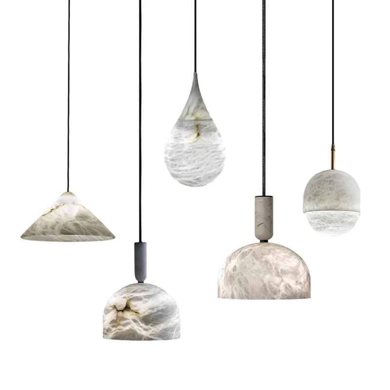 Assorted marble LED pendant lights in various shapes and sizes. Marble LED pendant light – modern ceiling lamp dimmable for stylish interiors.