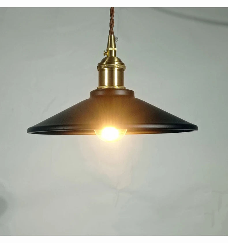 Black Industrial Brass Pendant Light with glowing bulb, ideal for moody bar lighting or industrial home décor.