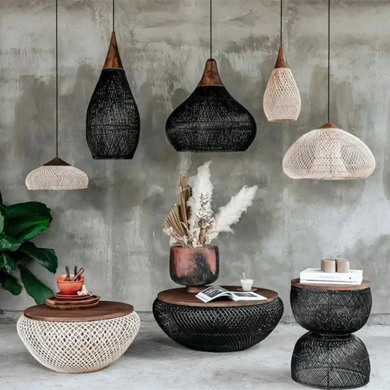 Modern pendant light collection in black and beige rattan with wood tops, styled in a cozy living room setting for home decor inspiration.