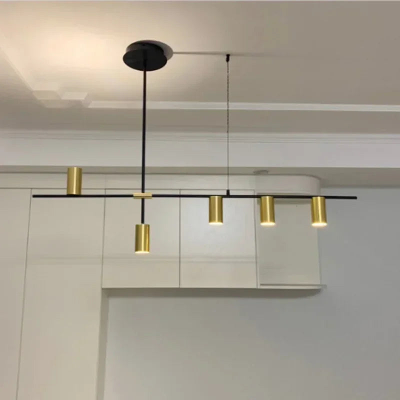 Gold and black modern minimalist spotlight bar ceiling light installed in a kitchen, offering stylish and adjustable illumination.